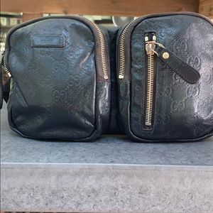 Black leather embossed GG Gucci belt bag